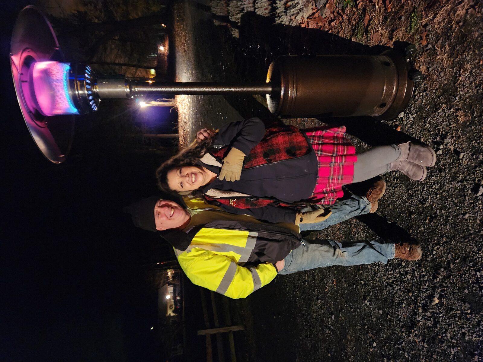 Tom and Maria walking hand in hand in a community memorial walk